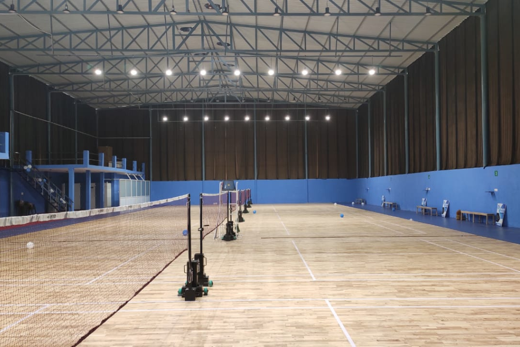 Badminton smash in court